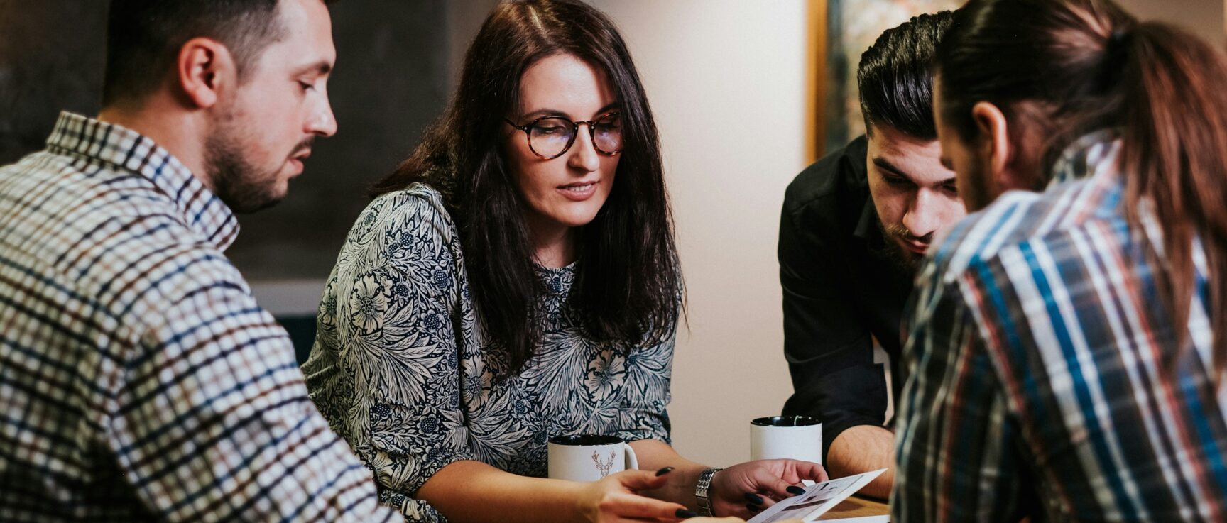 team members in an office discussing